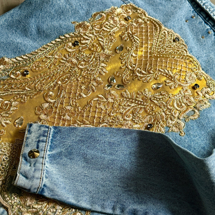 close-up of handcrafted gold beaded appliqué on denim jacket