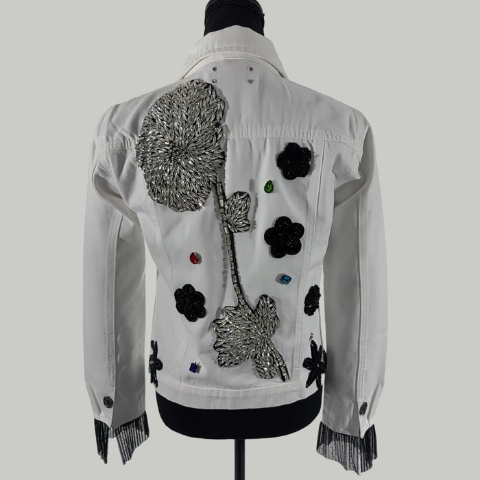 back view of crystal embellished denim jacket with appliqué and fringe
