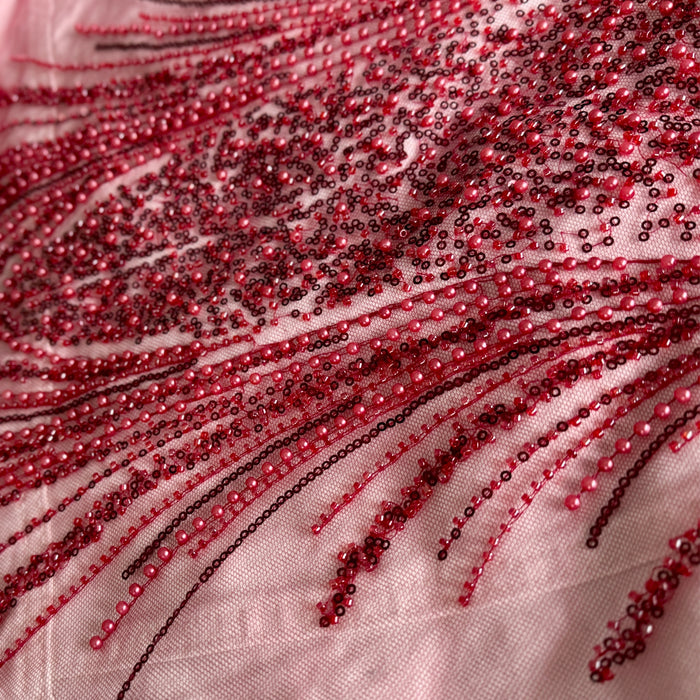 close-up of handmade red bead embroidery on denim jacket2