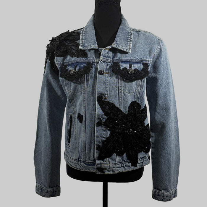 denim jacket with black appliqué and sequin embellishments