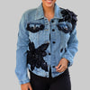 denim jacket with black floral beaded appliqué