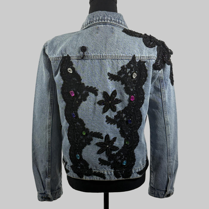 denim jacket with black appliqué and sequin embellishments