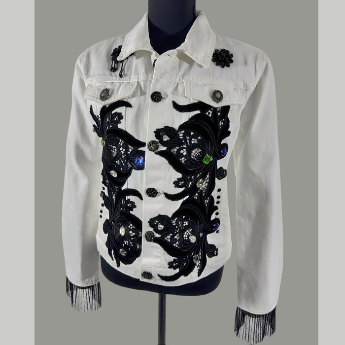 front view of crystal embellished denim jacket with appliqué and fringe