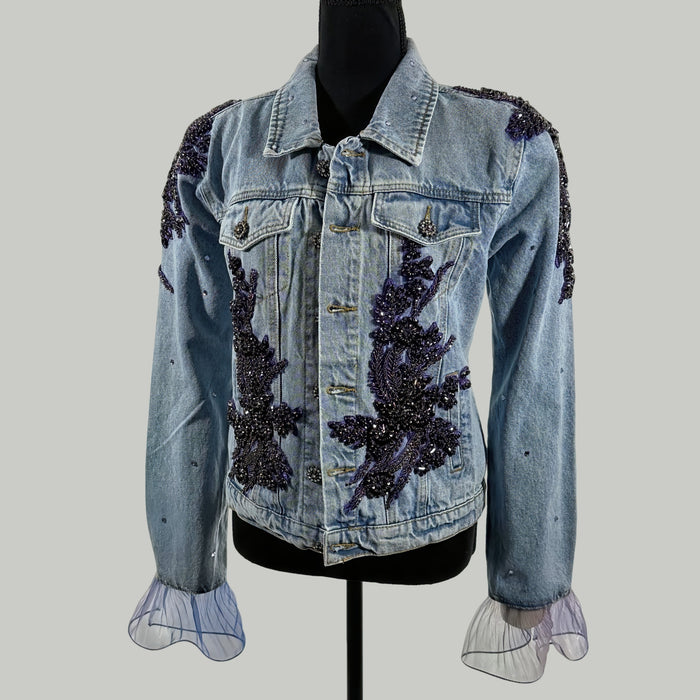 front view of purple embellished denim jacket with floral beadwork